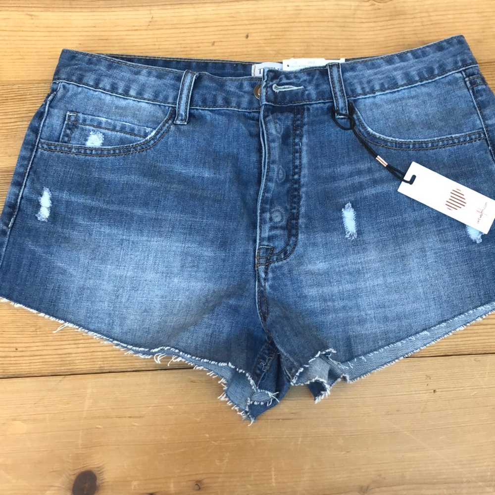 On thwelfth denim short cutoffs NWT frayed